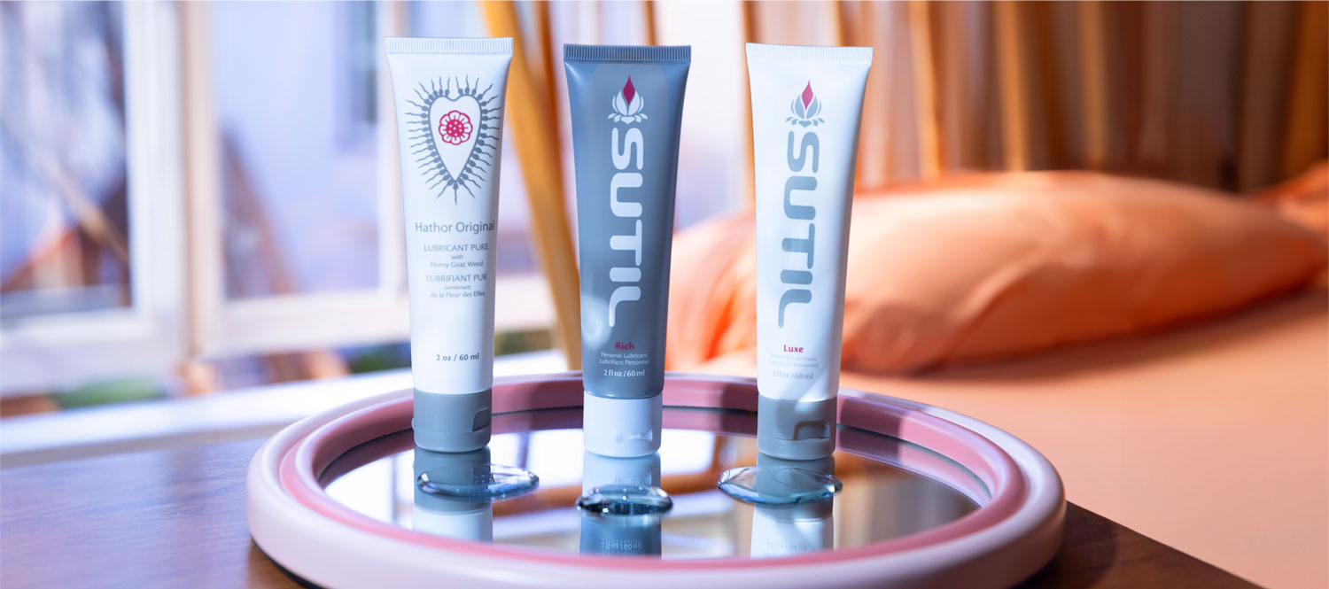 Sutil lubes Hathor Original, Rich and Luxe on display on a mirror